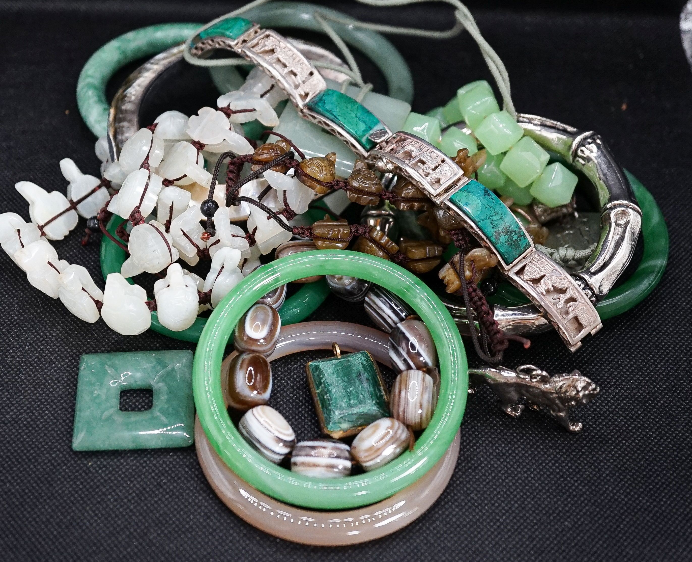A group of bangles and necklaces including jade and agate.